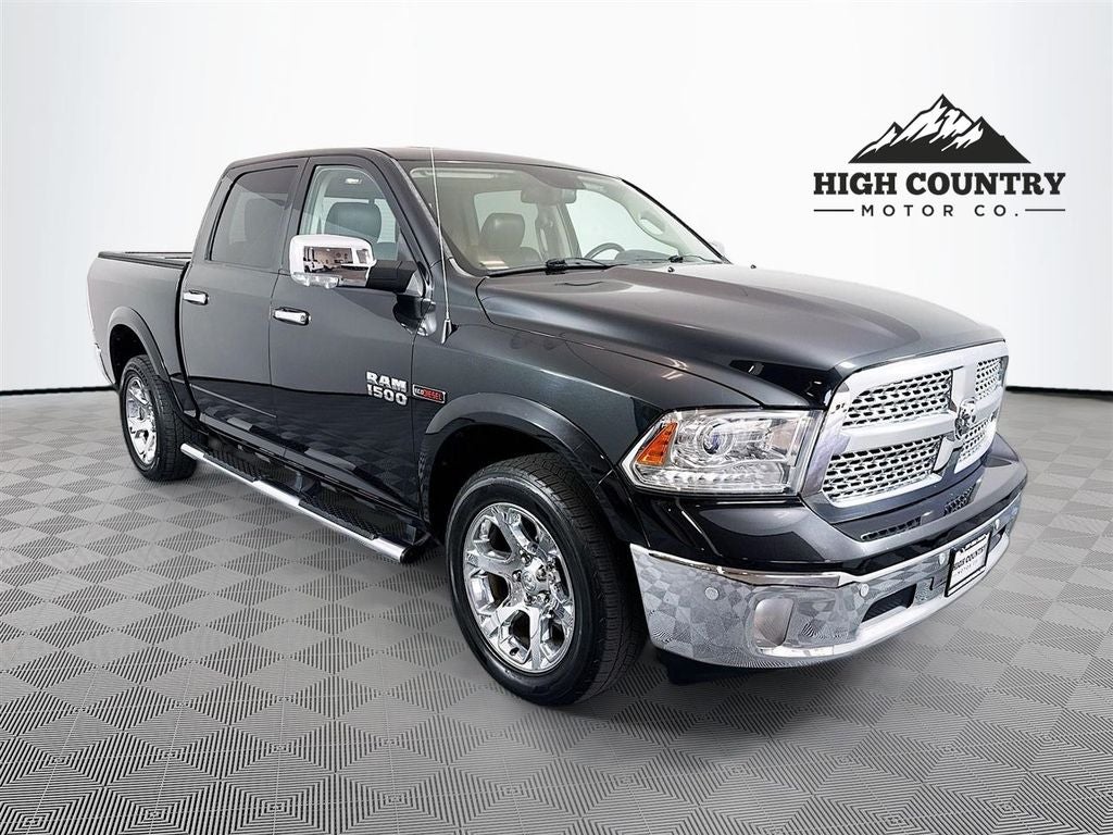 2015 RAM 1500 Laramie in Brilliant Black Crystal Pearlcoat — front three-quarter view