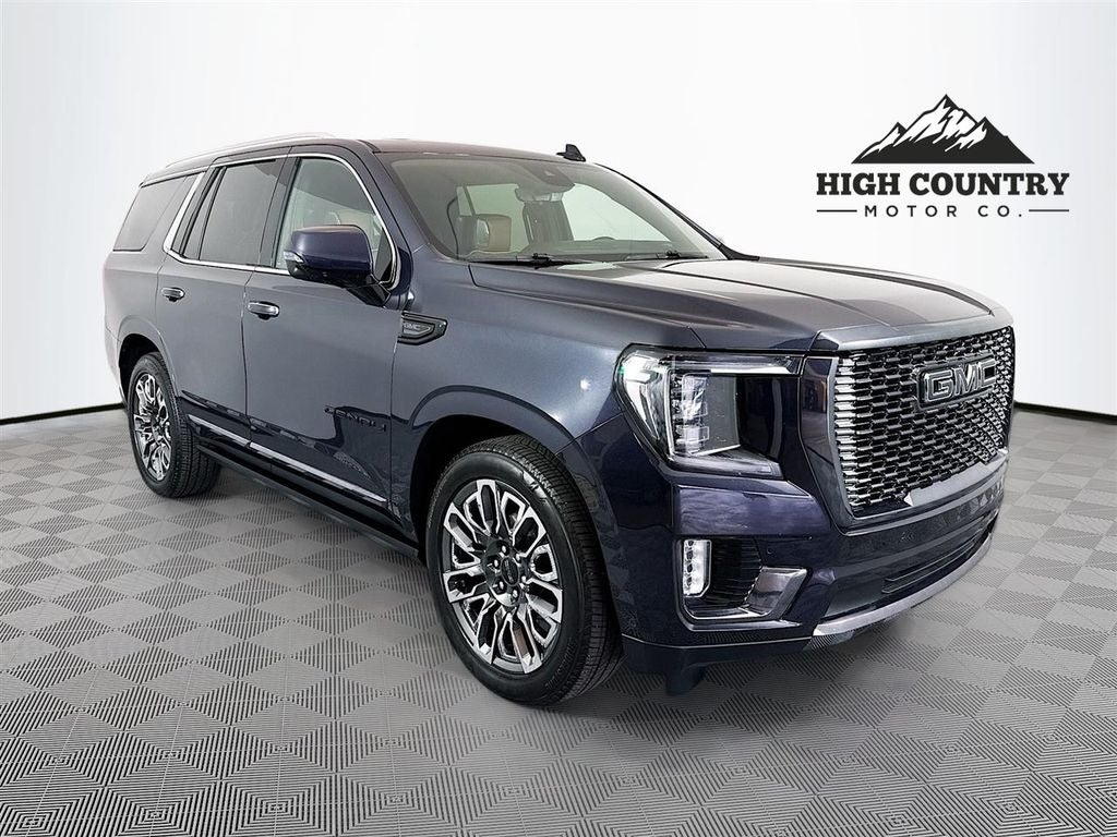 2024 GMC Yukon Denali Ultimate in Titanium Rush Metallic — front three-quarter view